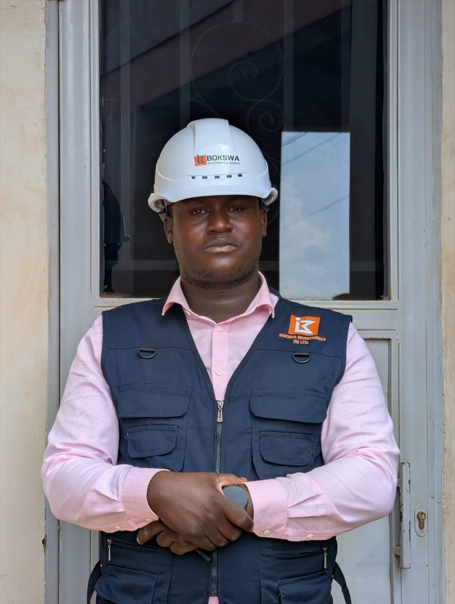 General Manager of BOKSWA Investments (U) Limited in a branded vest and BOKSWA hard hat