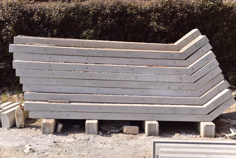 Reinforced precast concrete fence poles