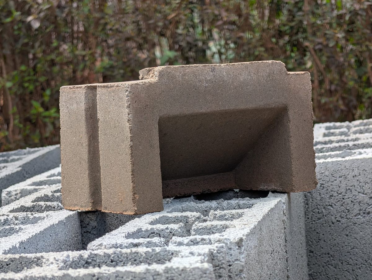 A BOKSWA concrete louver block resting on stacked units in the production yard
