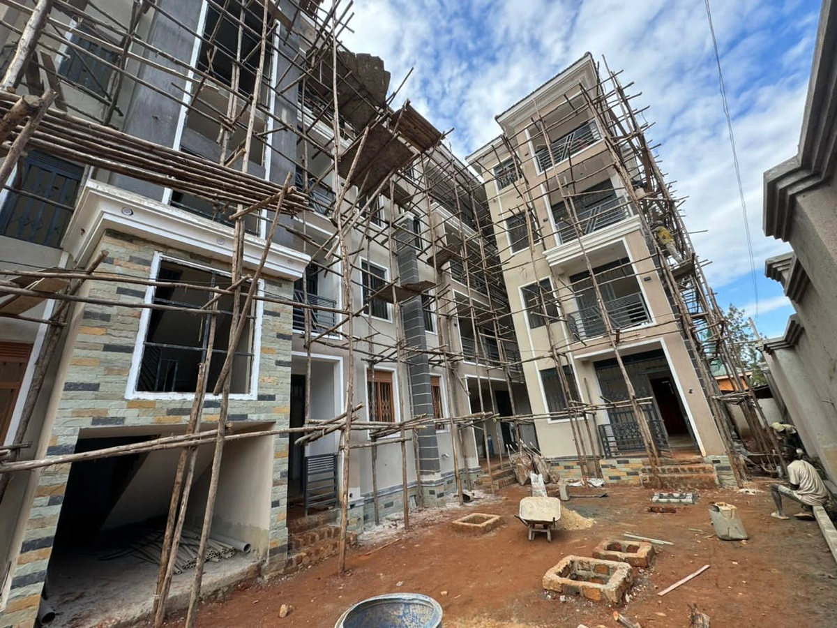 Apartment block under construction, block walling behind bamboo scaffolding