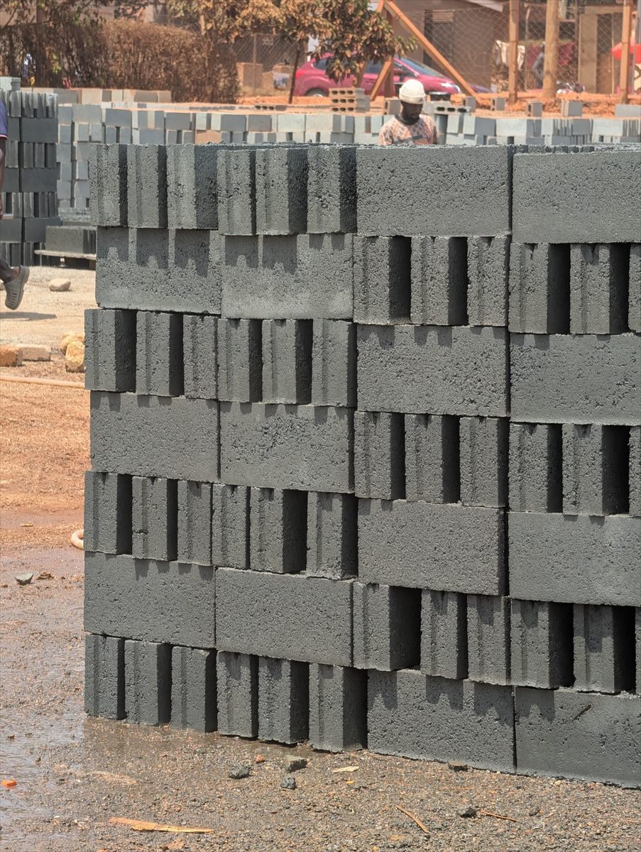 Stacked BOKSWA hollow blocks delivered to an active construction site