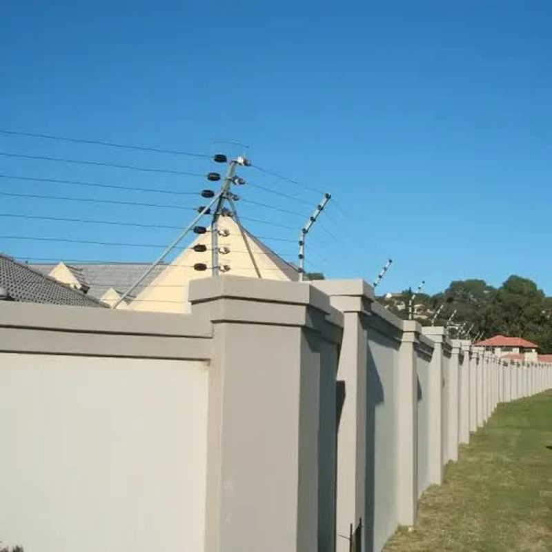 Rendered perimeter wall topped with an electric fence