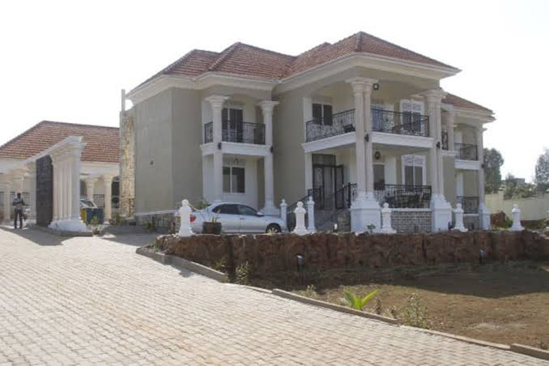 Completed two-storey house with a paved approach and driveway