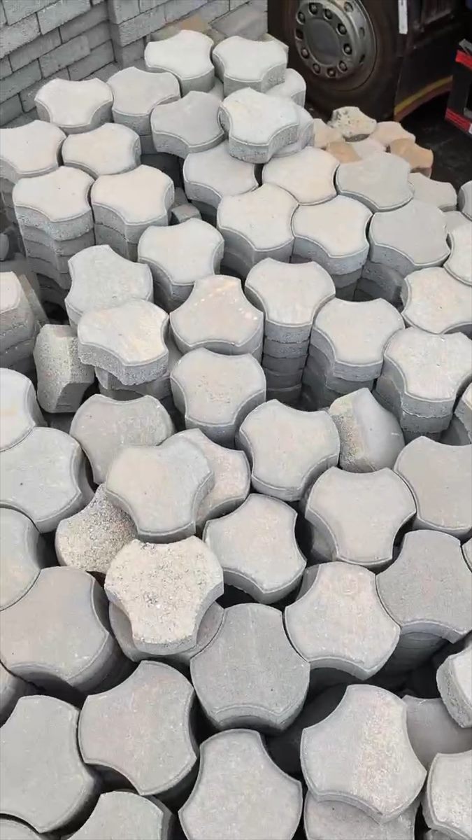 Field of BOKSWA interlocking pavers stacked in the yard