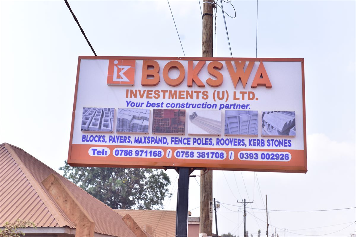 BOKSWA Investments roadside signboard listing blocks, pavers, maxpans, fence poles and kerb stones